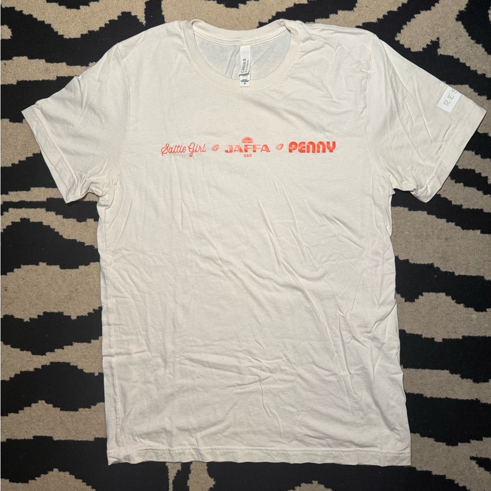 Jaffa Bella Canvas Cream Tee with Orange Accents